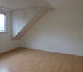 empty room, white walls, wooden floor, window, power outlet