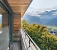 wooden ceiling, balcony, railings, view of mountains and valley
