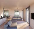modern living room with large windows, gray couches, wooden floor, round rug, kitchen island, bar stools, pendant lights, TV