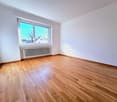 empty room, wooden floor, white walls, window, radiator