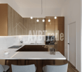 modern kitchen with marble countertops, wooden cabinets, modern appliances, pendant lights, floor heating