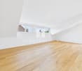 empty room, wooden floor, white walls, two windows