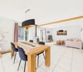 Dining room with wooden table, four chairs, white tiles, white walls, glass doors, cat tree, couch, coffee table, TV, painting