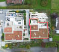 multi story building, multiple balconies, outdoor area with swimming pool