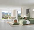 large sofa, dining table, balcony with railing, large windows, mountain view