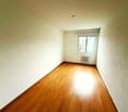 empty room, wooden floor, white walls, window, radiator