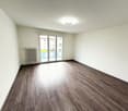 empty room, white walls, wooden floor, sliding glass door, balcony, radiator