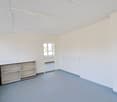 empty room, white walls, white ceiling, wooden shelf, windows, radiators