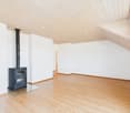 empty room, wooden floor, white walls, wooden ceiling, fireplace