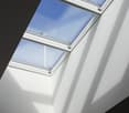 Large skylight windows, bright and airy space, white walls, modern design