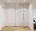 white walls, wooden floor, white door, built-in wardrobe, hallway leading to living room