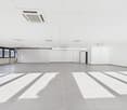 empty room, white walls, gray floor, windows, air conditioning