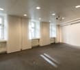 empty room, white walls, white ceiling, windows, radiators, projector