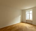 empty room, white walls, wooden parquet floor, white ceiling, window with white frames