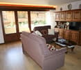 modern style, two couches, coffee table, TV stand, glass doors, lamp