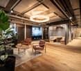 wooden floor, glass walls, chandelier, modern furniture, office space