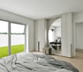 bedroom with glass wall, large bed, modern wardrobe, and grass view