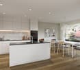 modern kitchen with island, white cabinets, wooden floor, large windows, dining area with table and chairs