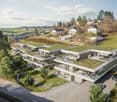 modern residential building with a green rooftop, multiple balconies, situated on a hill with scenic views