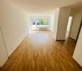 Empty room, wooden floor, white walls, large windows, sliding doors, radiator, power outlet, hallway