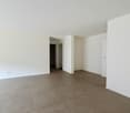 empty room with tiled floor, white walls, empty room