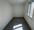 empty room, white walls, wooden floor, window, light fixture