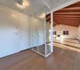 large room, wooden floor, white walls, glass doors, wooden ceiling, windows