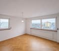 empty room, wooden parquet floor, 2 windows, 2 radiators, ceiling light