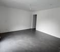empty room, white walls, gray floor, power outlets, door