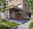 Modern house with glass walls, terrace, garden, red chairs and table