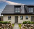 2 story house, brick wall, gray roof, gray doors, windows, stone wall entrance