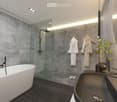 Bathtub, glass shower, wall towels, sink, modern lighting