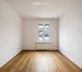 empty room, wooden floor, white walls, window, white radiator
