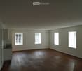 empty room, hardwood floors, white walls, 3 windows, countertop with sink and faucet