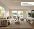 large windows, glass sliding door to balcony, white walls, beige couch, coffee table, armchair, TV, shelves, floor lamp, area rug
