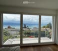 sliding glass doors, balcony, wooden floor, view of the sea and mountains