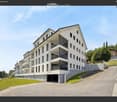Modern apartment building with multiple floors, balconies, and a garage entrance.