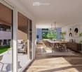 Modern living and dining area with light wood flooring, large windows, a sofa, dining table with chairs, pendant lights, and decorative plants.