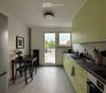 Modern kitchen with light green cabinets, stainless steel appliances, and a dining area with a table and chairs. The space features tiled flooring, a large window, and a door leading to a balcony.