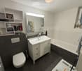 Modern bathroom with a white sink, toilet, bathtub, large mirror, and built-in shelves holding toiletries. Dark grey tiles on the floor and walls.
