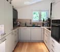 {"type": "Kitchen", "objects": ["refrigerator", "oven", "sink", "faucet", "coffee maker", "cupboard", "bottle", "fridge magnet", "cupboard", "bottle", "bottle", "bottle", "bottle", "bottle", "bottle", "bottle", "bottle", "bottle", "bottle", "bottle", "bot
