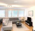 Modern living room with light-colored walls, wooden flooring, large windows with blinds, a sectional sofa, coffee table, dining table with chairs, TV stand, and decorative plants.