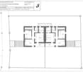 First-floor plan of a two-family house with two apartments, each featuring a bedroom, bathroom, and terrace.