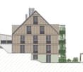 The building has three floors with multiple windows and a triangular roof. The facade is made of wooden panels with a brown color. There are trees in front of the building and an auxiliary building on the right side.
