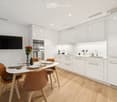 {"type": "Furnished Room", "objects": ["dining table", "chair", "bottle", "vase", "faucet", "sink", "oven", "cup", "faucet", "bottle", "faucet", "faucet", "bottle", "bottle", "bottle", "bottle", "bottle", "bottle", "bottle", "bottle", "bottle", "bottle",