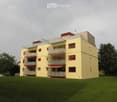 Four-story residential building with yellow facade, multiple balconies, and a rooftop terrace.