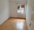 empty room, wooden floors, white walls, window, radiator