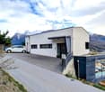modern style house, white exterior, white and gray garage, white car, mountainous region, view