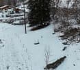 empty snowy slope, snow on the ground, no plants or trees