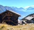 2 story wooden house, located in a mountainous region with beautiful views